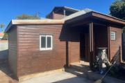 A louer petite maison F1 en bois dans une impasse