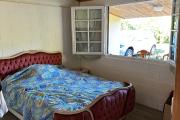 A vendre Maison Bourbon Bois type F3/4 au 2ème village de la plaine des palmistes sur 409 m² de terrain